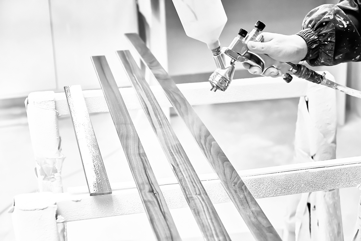 Man,Painting,Furniture,Details,In,A,Spray,Booth.,Worker,Using